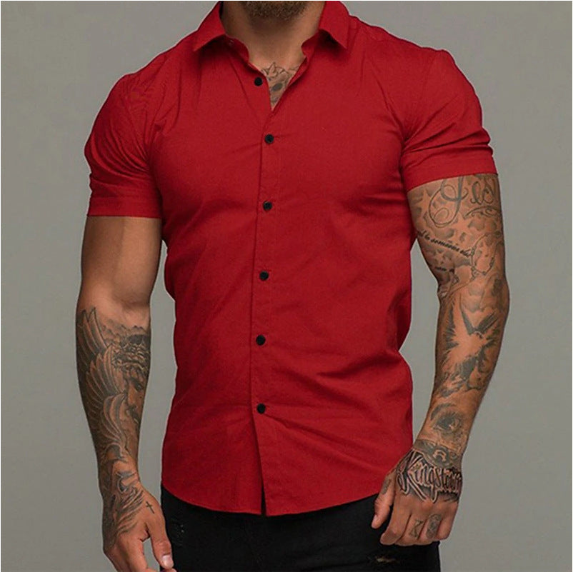 A muscular man in a solid-color lapel short-sleeved shirt